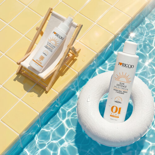 <b>Proteggi e<br>idrata i tuoi ricci</b><br>anche sotto il sole
